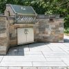 Outdoor kitchen with ashlar veneer on patio