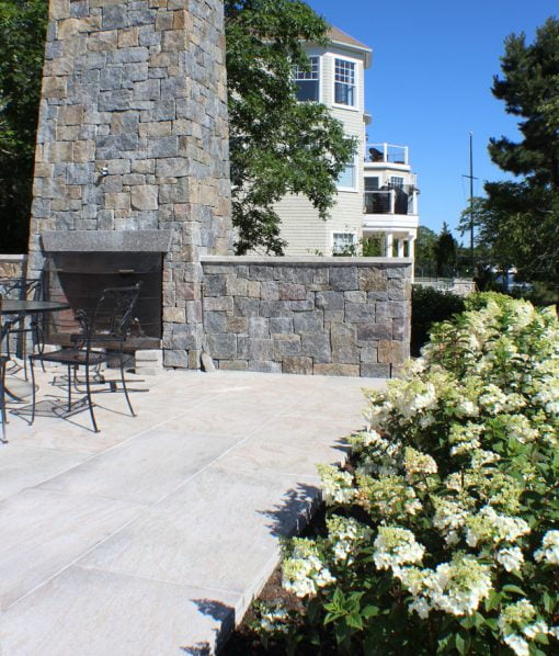 outfoor fireplace next to pool