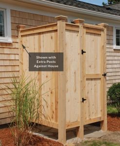outdoor shower kit with extra cedar posts against house