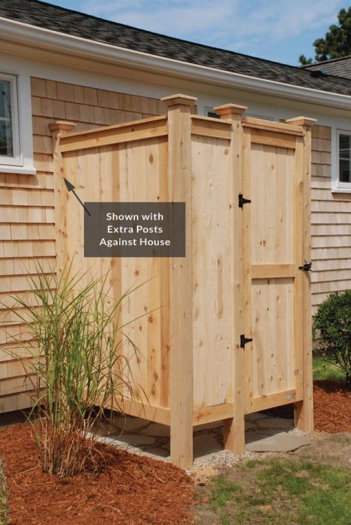 outdoor shower kit with extra cedar posts against house