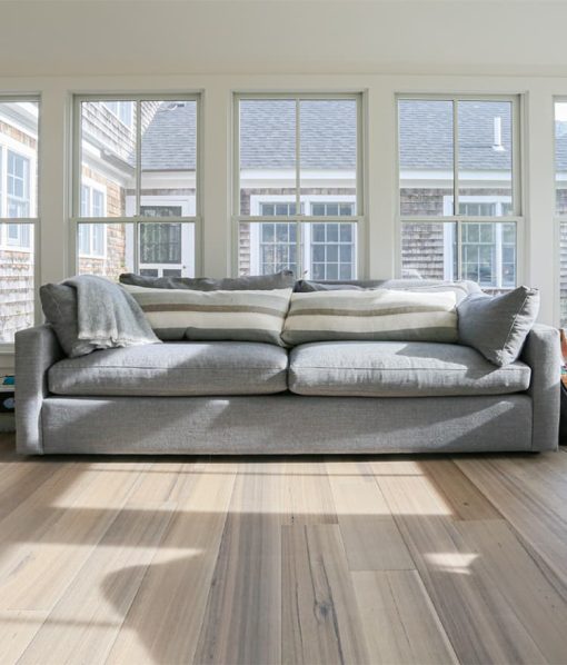 grey wide wood plank flooring sunroom