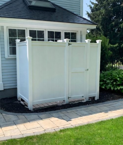 side of house view with outdoor showers in azek pvc color