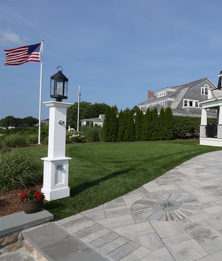 Waterfront Patio featuring Techo Bloc Blu60 Slate Grey Pavers, Ebel Furniture and Custom Fire Pit