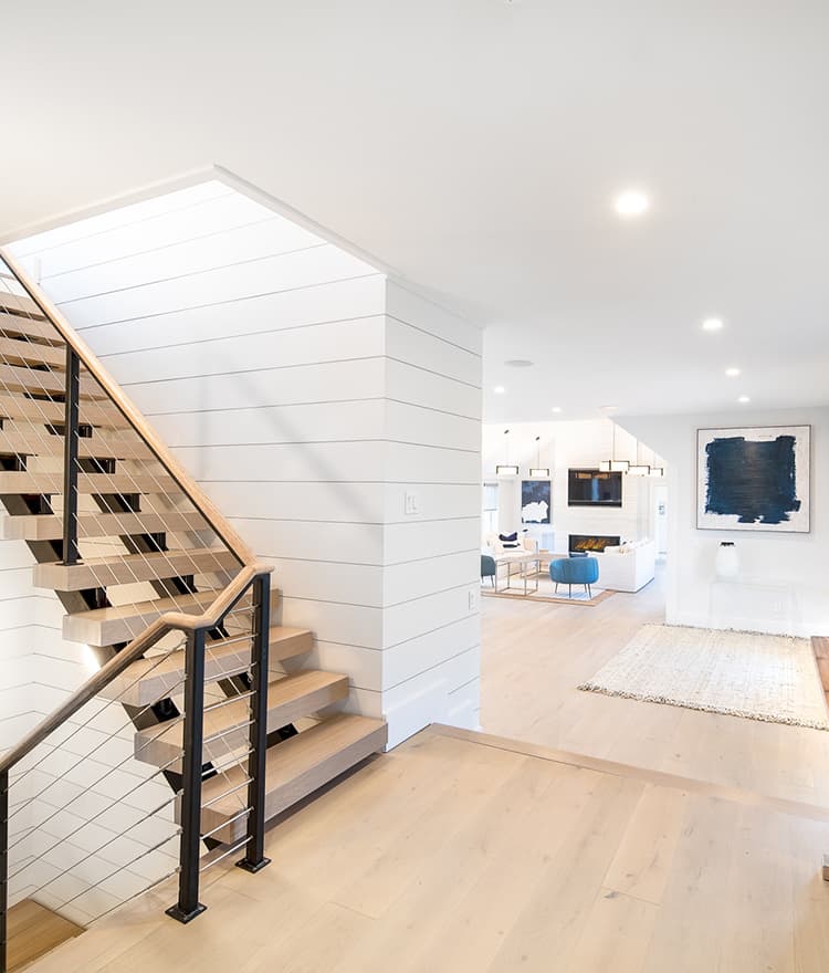 Sawyer Mason Structured Fogg Wide Plank Floors with matching stair treads and shiplap walls