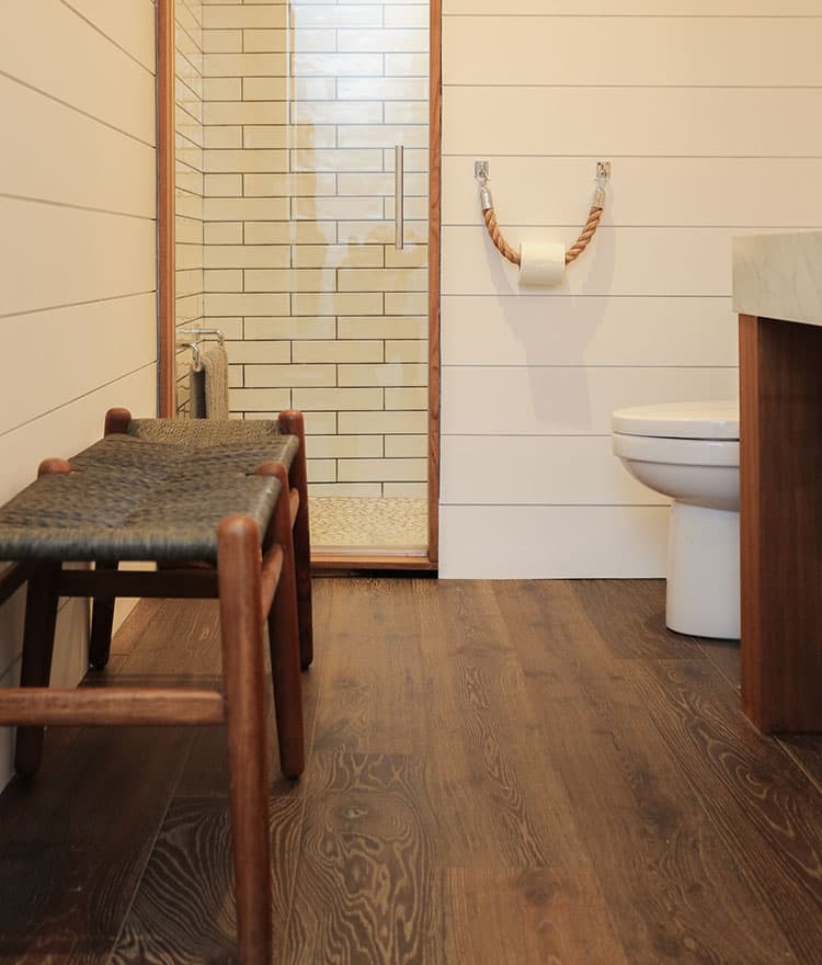 Cozy Cottage with Sawyer Mason Esplanade installed in bathroom with shiplap