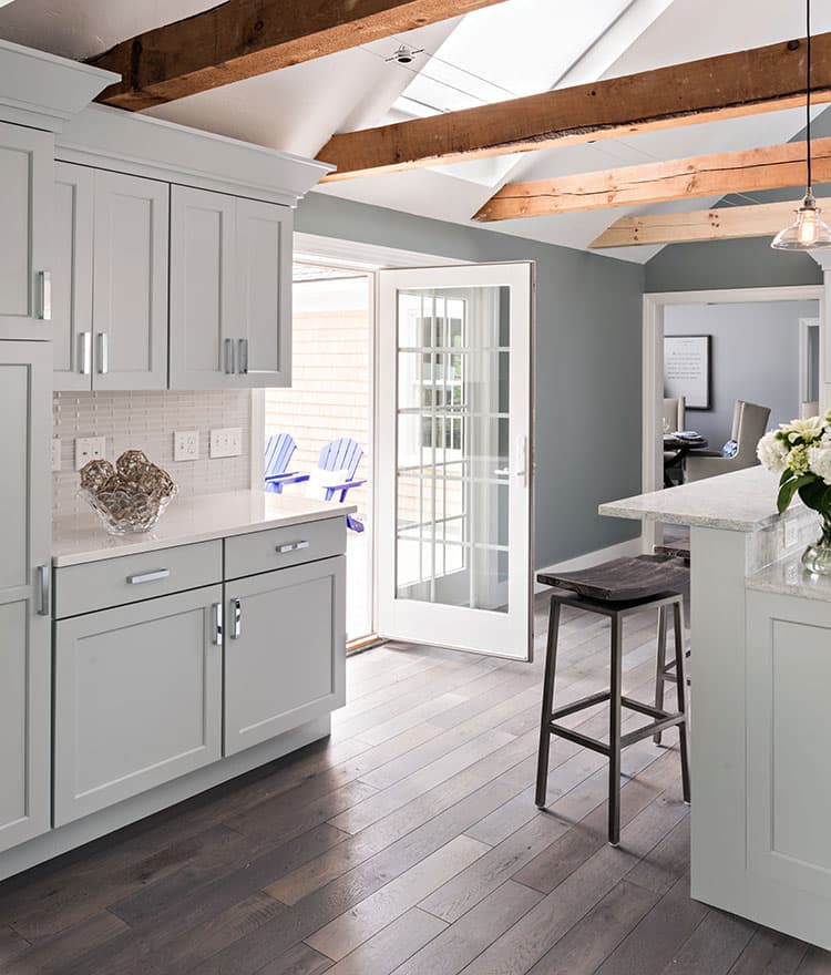 Contemporary Cottage with custom prefinished floors and reclaimed beams