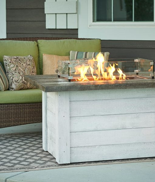 lit coastal style fire table