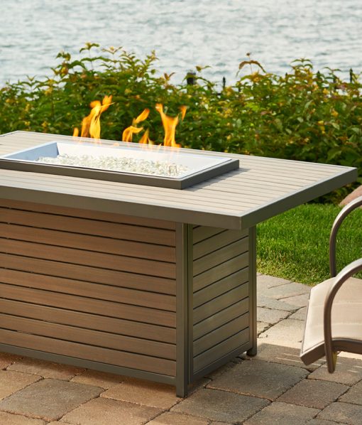 lit fire pit made of decking