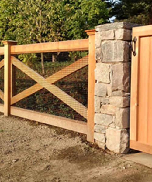 cedar fence with gate and stone