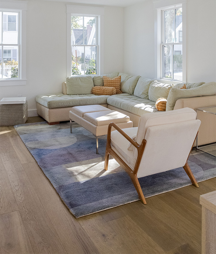 Living room with off white furniture and brown oak floors