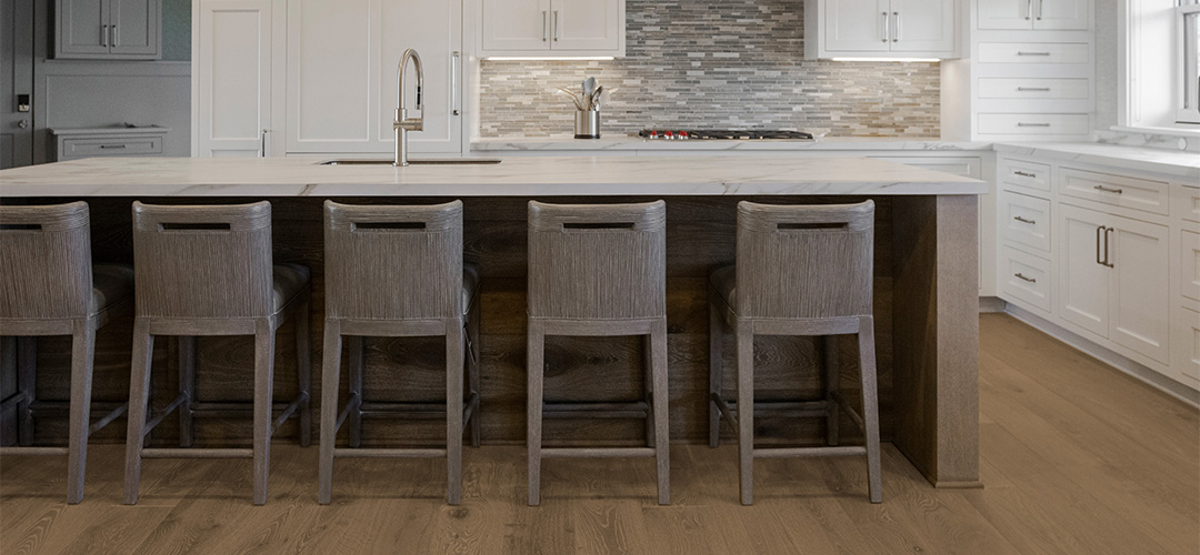 Contemporary kitchen with medium brown wide plank flooring and neutral accents