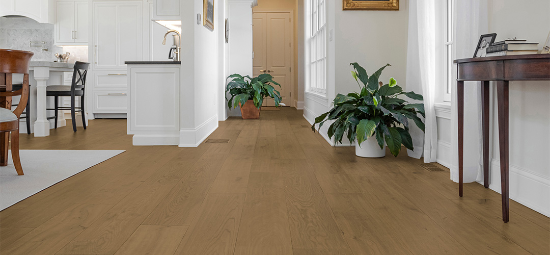 Warm brown flooring in light hallway setting