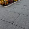 Large format running bond pattern with dark gray granite pavers 24x48