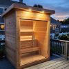 outdoor sauna shown on back deck of home at dusk