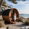 coastal home with a woman opening sauna door