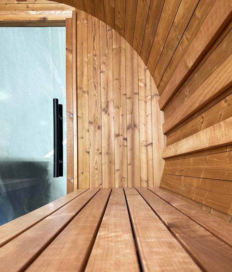 angular image of wood inside of a barrel sauna