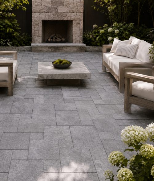 patio with gray stone pavers and fireplace